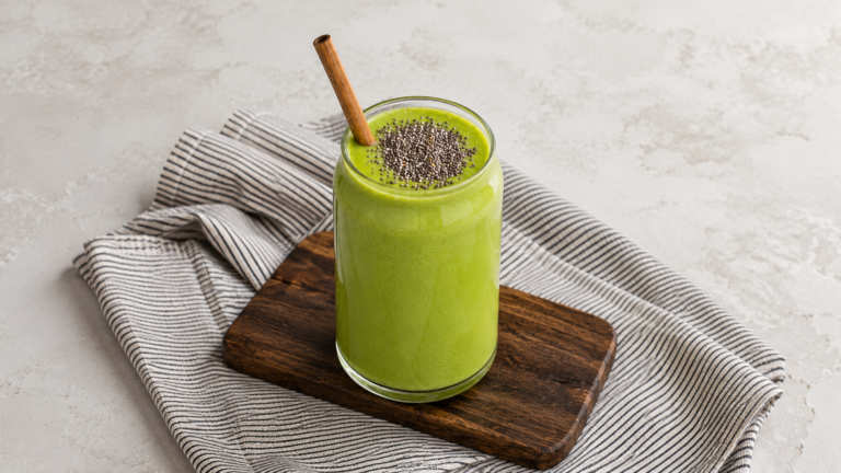 Creamy keto avocado lime coconut shake served in a chilled glass